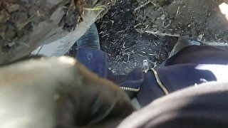 Pov lad unzips and flops it out to take a yellow piss next to muddy tire