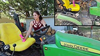 Farm girl Bailey Brewer rides her faithful John Deere tractor.
