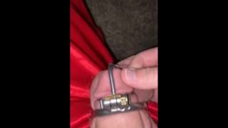 Rubbing his Tiny Caged Dick