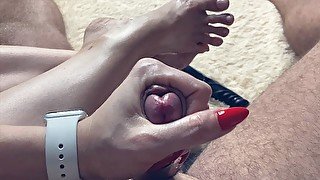 Close up jerking off my cock with red manicure on the background leg