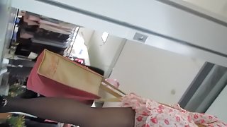 Charming pantyhose legs up the flowered skirt