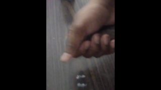 Stroking Cock in window