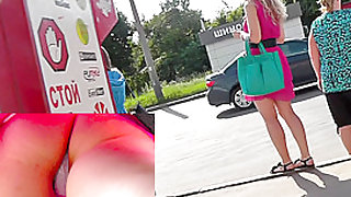 Upskirt cam presents blonde's succulent buttocks