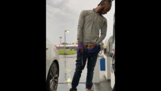 SMOKEPOLEBOY JACKING BIG BLACK COCK AT GAS STATION DURING RAINY DAY.