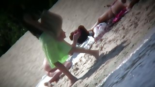 Nude blonde babe sunbathing at the beach spy cam video