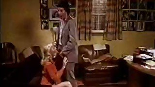 Bosomy blonde gives her lover a great blowjob right in his office