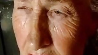 Grandma plays with some dildos