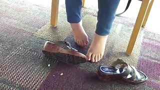 cute teen feet under table