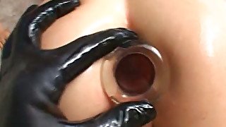 Pretty teen lifts her jeans skirt up and fucks her ass hole with glass sex toy