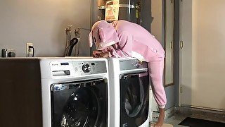 Bunny onesie humps dryer while doing laundry