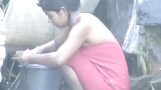 wow... outstanding desi village gal bathing outside