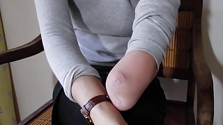 Arm Amputee putting on a watch