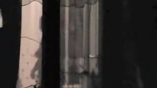Chubby female is voyeured through window undressing