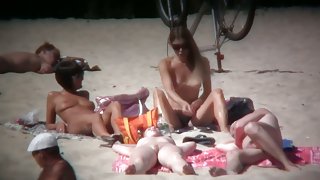 2 white babes with nice big side saggin breasts on a nude beach