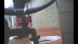 Girl in leather boots is getting spied pissing on toilet