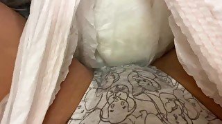 Peeing in panties inside a diaper