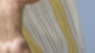 A dazzling nude beach voyeur video