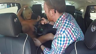 Huge boobed Blonde gives Mitt a BJ in car