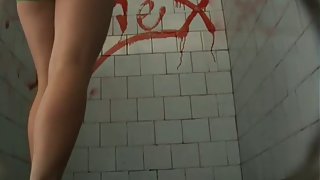 A brunette model goes to the pool bathroom to take a huge shit