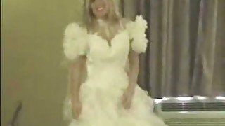Blonde in wedding dress sucks a cock and fingers her pussy