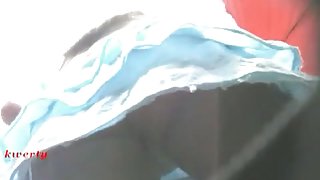 Brunette girl in a blue one piece upskirt voyeur video