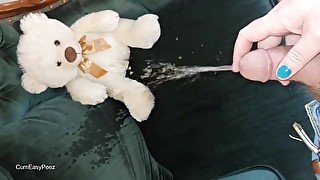 She plays with my cock as I piss on an old chair