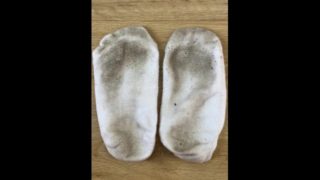 Close up of very smelly dirty white ankle socks
