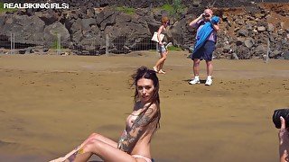 Babe loves having her half naked body photographed in public