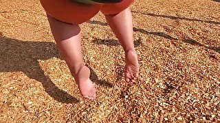 BBW Relaxing At Park Barefoot On A Swing
