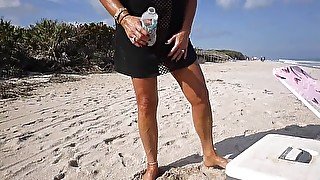 Amazingly hot MILF standing public beach pee in front of strangers.