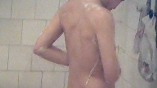 Brunette amateur woman with perky tits washing in the shower