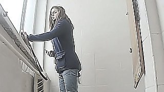 Brunette young white chick in the toilet pisses on hidden cam