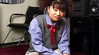 Weird looking pigtailed coed chick Yuri Mitsui squeezes her own tits