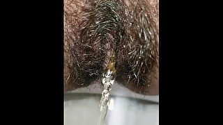 Indian cool girl pissing with beautiful view in village toilet - almost caught