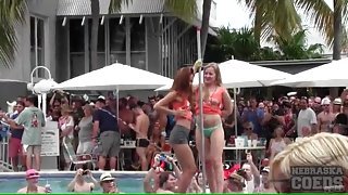 Topless dancing amateurs at a pool party