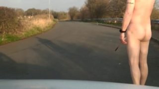 Naked in road with pump on
