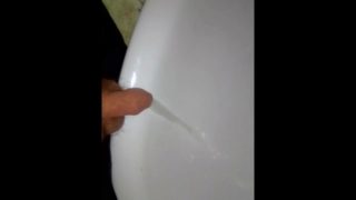 Chubby boy piss in a sink