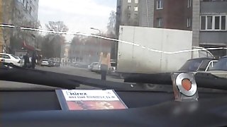 Busty girl gives head in the car