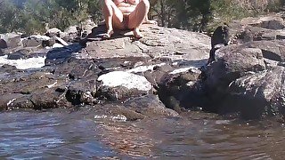 Nude Outdoor Swimming and Lounging on Rocks Others Around