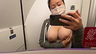 I got SO horny on the plane! I had to play with my swollen Asian tits