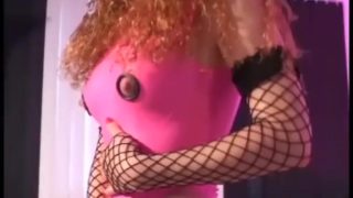 Beautiful redhead in shiny latex and fishnet thigh highs getting fucked