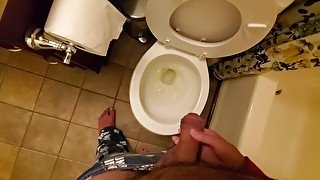Gently holding my boyfriend's dick while he pees in the toilet