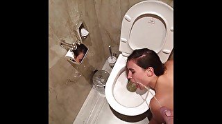 human toilet waiting for me to piss all over her face next to the toilet at the hotel