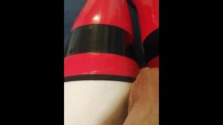 Shiny red latex rubber stockings closeup