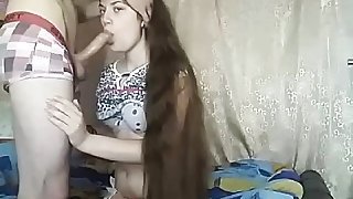 Brunette cocksucker with extremely long hair gives head and